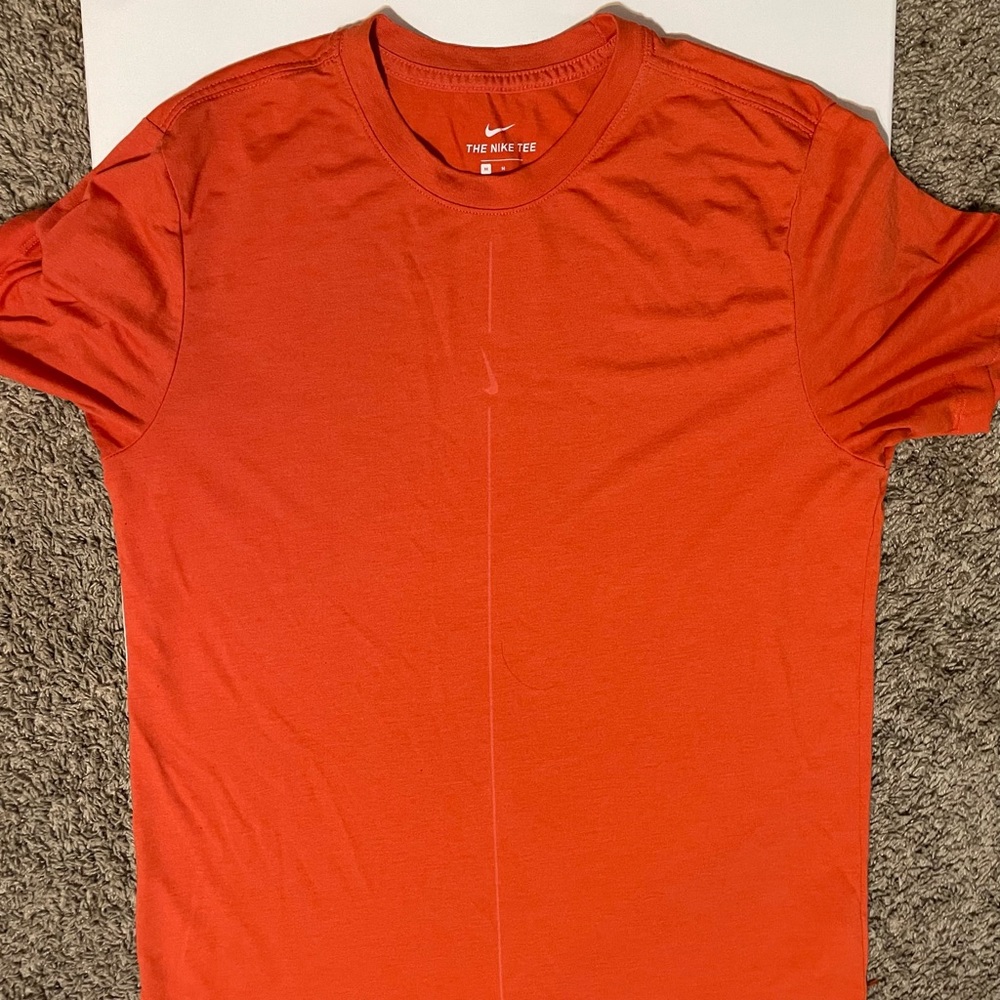 Orange Nike Dri-fit shirt